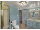 Well-lit bathroom featuring a glass shower, classic vanity, and a neutral color palette at 8990 Pickwick Dr, Indianapolis, IN 46260