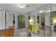 Light blue bedroom featuring a large cabinet and mirrored sliding closet doors at 8990 Pickwick Dr, Indianapolis, IN 46260
