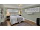 Cozy bedroom with comfortable bed, decorative windows, and warm ambient lighting at 8990 Pickwick Dr, Indianapolis, IN 46260