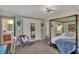 Spacious bedroom featuring a four-poster bed, closet, and doorway to an adjoining bathroom at 8990 Pickwick Dr, Indianapolis, IN 46260