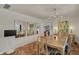 Elegant dining room with hardwood floors, stylish chandelier, buffet, and decorative mirrors at 8990 Pickwick Dr, Indianapolis, IN 46260