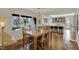 Dining area with herringbone floors and a view into the kitchen at 8990 Pickwick Dr, Indianapolis, IN 46260
