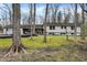 Ranch home with a front yard adorned with mature trees at 8990 Pickwick Dr, Indianapolis, IN 46260
