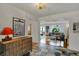 Bright foyer with stone floors and a view into the living room at 8990 Pickwick Dr, Indianapolis, IN 46260