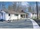 A charming ranch-style home featuring a stone walkway and meticulously landscaped gravel front yard at 8990 Pickwick Dr, Indianapolis, IN 46260