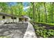 Charming single-story home with a stone walkway and lush landscaping at 8990 Pickwick Dr, Indianapolis, IN 46260