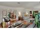 Open concept living room featuring hardwood floors, fireplace, and stylish decor at 8990 Pickwick Dr, Indianapolis, IN 46260