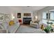 Bright living room features comfortable seating, a stylish piano, and access to the outdoors at 8990 Pickwick Dr, Indianapolis, IN 46260
