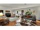 Bright and spacious living room features large windows, hardwood floors, and stylish furnishings at 8990 Pickwick Dr, Indianapolis, IN 46260
