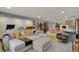 Open-concept living room showcases stylish furnishings and seamless flow to the dining area at 8990 Pickwick Dr, Indianapolis, IN 46260