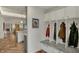 Functional mudroom features built-in storage, bench seating, and access to the rest of the home at 8990 Pickwick Dr, Indianapolis, IN 46260
