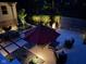 Well-lit patio area, featuring a dining set, umbrella, and cozy seating, creating a relaxing outdoor space at 8990 Pickwick Dr, Indianapolis, IN 46260