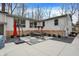 Backyard patio featuring an outdoor dining area and modern design elements at 8990 Pickwick Dr, Indianapolis, IN 46260
