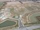 Aerial view of new construction with homes, home sites, ponds and infrastructure in a Primary planned community at 915 Saddlebrook Farms Blvd, Whiteland, IN 46184