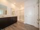 Modern bathroom with double vanity, a glass-enclosed shower, and sleek fixtures at 915 Saddlebrook Farms Blvd, Whiteland, IN 46184
