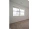 Bright bedroom with a large window, neutral carpet, and fresh white walls at 915 Saddlebrook Farms Blvd, Whiteland, IN 46184