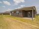 A newly built brown brick house featuring a covered patio with ample room for outdoor seating at 915 Saddlebrook Farms Blvd, Whiteland, IN 46184