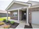 Exterior shot of a charming single-Gathering home with brick facade, landscaping and inviting entryway at 915 Saddlebrook Farms Blvd, Whiteland, IN 46184