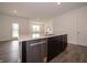 Bright kitchen with a large center island, stainless steel appliances, and sleek countertops at 915 Saddlebrook Farms Blvd, Whiteland, IN 46184