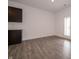 Spacious living area featuring modern wood-look flooring and ample natural light at 915 Saddlebrook Farms Blvd, Whiteland, IN 46184