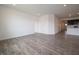 Large living room with laminate floors, recessed lighting, and white walls at 915 Saddlebrook Farms Blvd, Whiteland, IN 46184