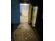 View into the unfinished basement, showing cement flooring and a hot water tank at 918 N Olney St, Indianapolis, IN 46201
