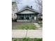 Modest home with a covered porch, showing the front exterior at 918 N Olney St, Indianapolis, IN 46201