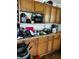 Kitchen with wooden cabinets, stainless steel sink, microwave, and quartz countertops at 918 N Olney St, Indianapolis, IN 46201
