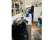 Utility room features laminate wood floor, washing machine, dryer, and storage shelves at 918 N Olney St, Indianapolis, IN 46201