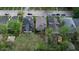 Aerial view showcasing the home nestled among lush, mature trees in a neighborhood setting at 926 N Dearborn St, Indianapolis, IN 46201