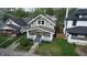 Aerial view of a charming two-story home with a professionally landscaped yard in a residential neighborhood at 926 N Dearborn St, Indianapolis, IN 46201