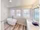 Bright bathroom with a soaking tub and dual sinks at 926 N Dearborn St, Indianapolis, IN 46201