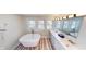 Bright bathroom with a soaking tub and dual sinks at 926 N Dearborn St, Indianapolis, IN 46201