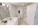 Well-lit bathroom with a vanity, mirror, toilet, and glass-enclosed shower at 926 N Dearborn St, Indianapolis, IN 46201