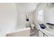 Cozy bathroom featuring a window, shower, vanity with sink, and toilet with blue towels at 926 N Dearborn St, Indianapolis, IN 46201