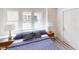 Sunlit bedroom featuring bedside tables with lamps, and stylish blue bedding at 926 N Dearborn St, Indianapolis, IN 46201