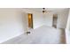 This bedroom has neutral carpeting, and a ceiling fan, and three doors, creating a serene and comfortable atmosphere at 926 N Dearborn St, Indianapolis, IN 46201