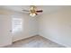 This room features a ceiling fan with a light and a double hung window that floods the room with natural light at 926 N Dearborn St, Indianapolis, IN 46201