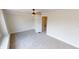 This bedroom has neutral carpeting, and a ceiling fan, and one door, creating a serene and comfortable atmosphere at 926 N Dearborn St, Indianapolis, IN 46201