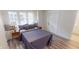 Well-lit bedroom featuring stylish bedding and a cozy window seat at 926 N Dearborn St, Indianapolis, IN 46201