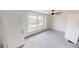 The room has great natural light, a ceiling fan, neutral carpeting, and crisp white paint at 926 N Dearborn St, Indianapolis, IN 46201