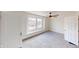 Bedroom features neutral carpet, ceiling fan, and bright window at 926 N Dearborn St, Indianapolis, IN 46201
