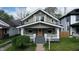 Charming two-story home with a welcoming front porch and professionally landscaped yard at 926 N Dearborn St, Indianapolis, IN 46201