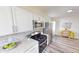 Beautiful kitchen with stainless appliances, granite counters and an adjoining dining area at 926 N Dearborn St, Indianapolis, IN 46201