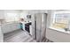 Bright kitchen featuring modern stainless steel appliances, granite countertops, and white cabinets at 926 N Dearborn St, Indianapolis, IN 46201