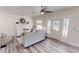 Spacious living room with a ceiling fan, natural light, and hardwood style flooring at 926 N Dearborn St, Indianapolis, IN 46201