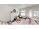 Bright living room featuring a decorative fireplace, modern decor, and a comfortable gray sofa at 926 N Dearborn St, Indianapolis, IN 46201