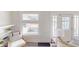Bright living area with built-in shelves, and large windows providing abundant natural light at 926 N Dearborn St, Indianapolis, IN 46201