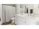 Bright bathroom with double sinks, a large mirror, and a shower with a curtain at 951 Brookstone Dr, Franklin, IN 46131