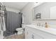 Updated bathroom features a modern vanity, stylish mirror, and shower with gray curtain at 951 Brookstone Dr, Franklin, IN 46131